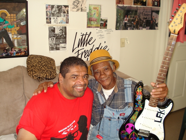 LINDELL SINGLETON, WORKING AT MLK SCHOOL IN THE NINTH GETTING A GUITAR LESSON. 
